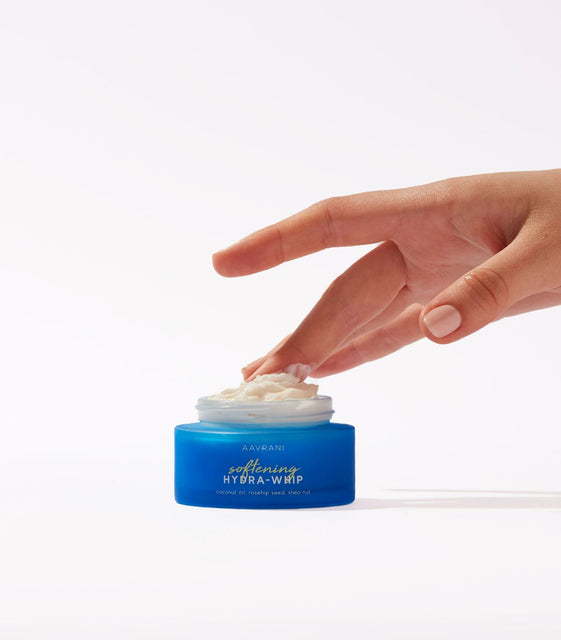 Model dipping fingers into AAVRANI Softening Hydra-Whip
