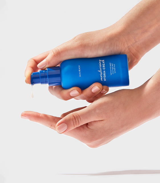 AAVRANI Moisturizing Hydra-Cream dropping onto finger
